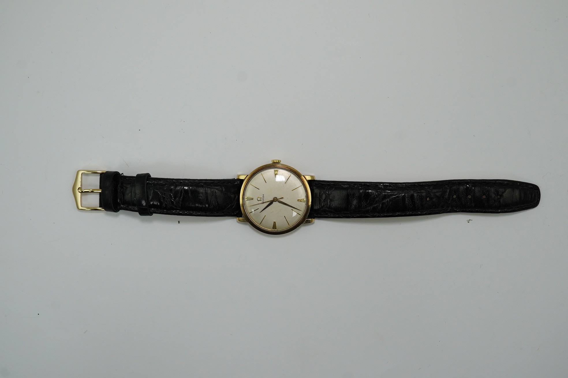 A gentleman's late 1950's 9ct gold Omega manual wind wrist watch